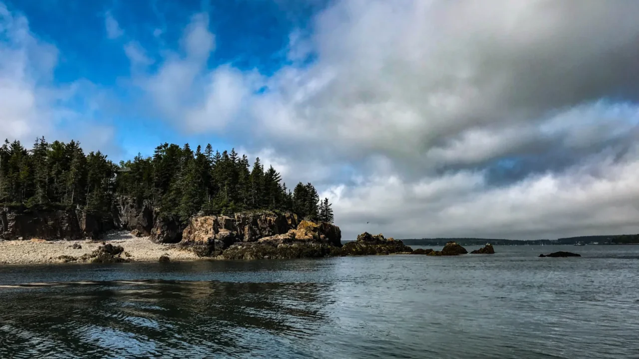 Rocky Atlantic shoreline beneath storm clouds in Acadia National Park