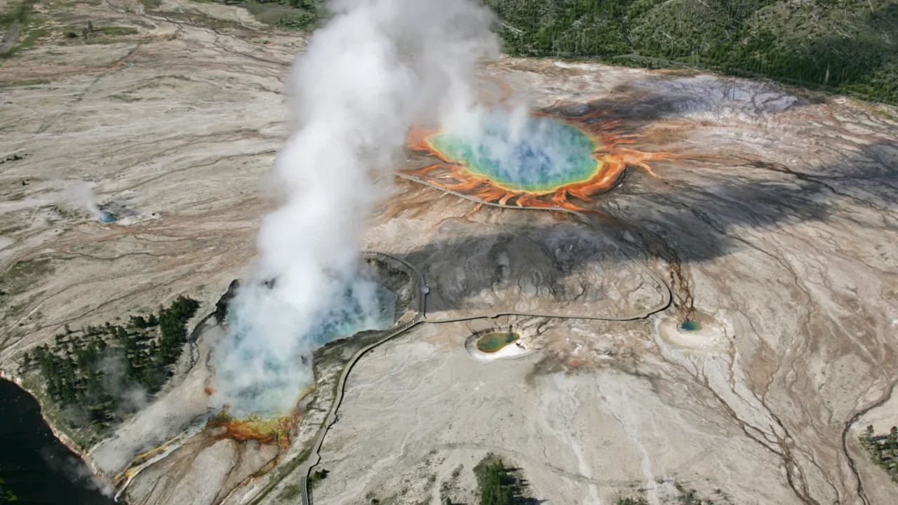 Grand Prismatic Spring and steaming Excelsior Geyser in Yellowstone National Park