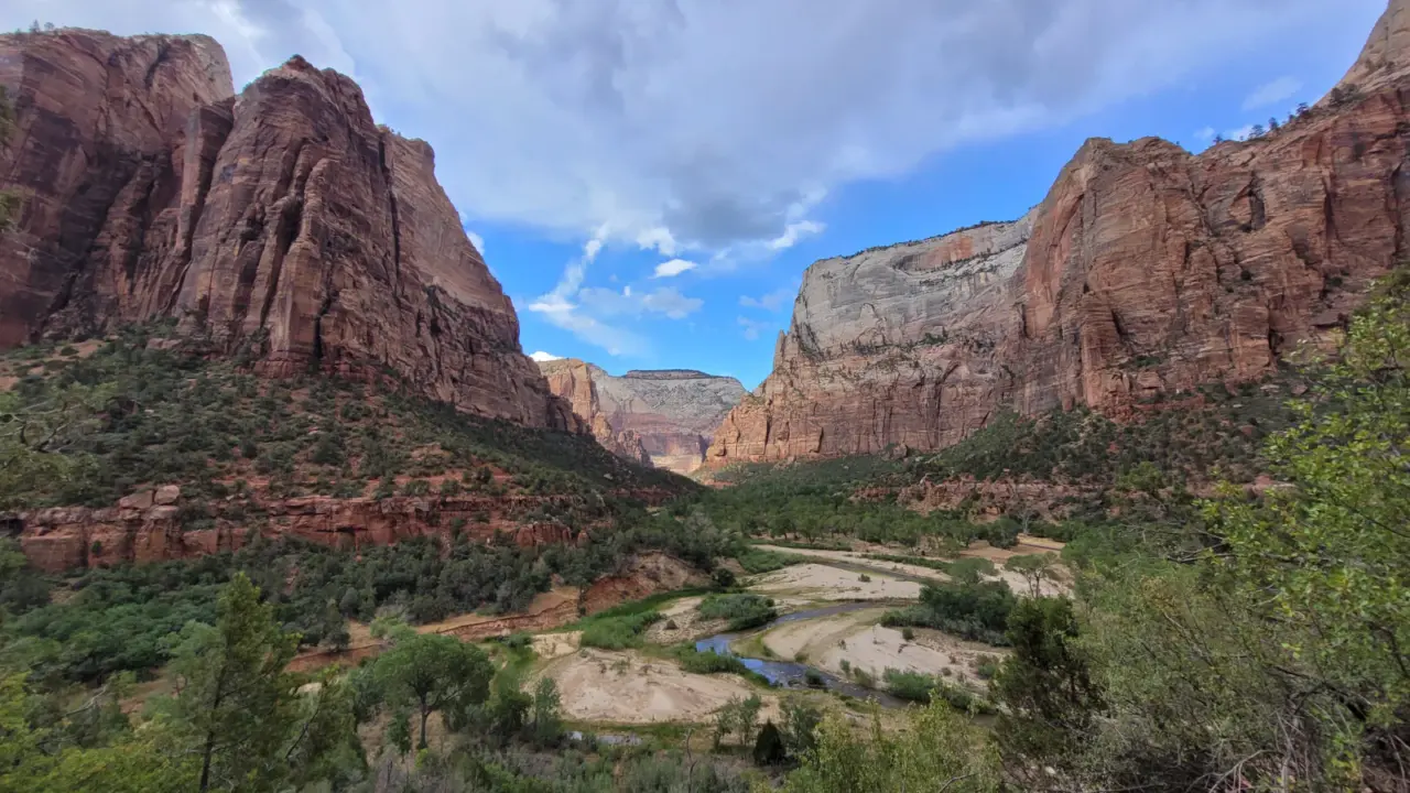 Mountain cliffs beneath blue sky in Zion National Park