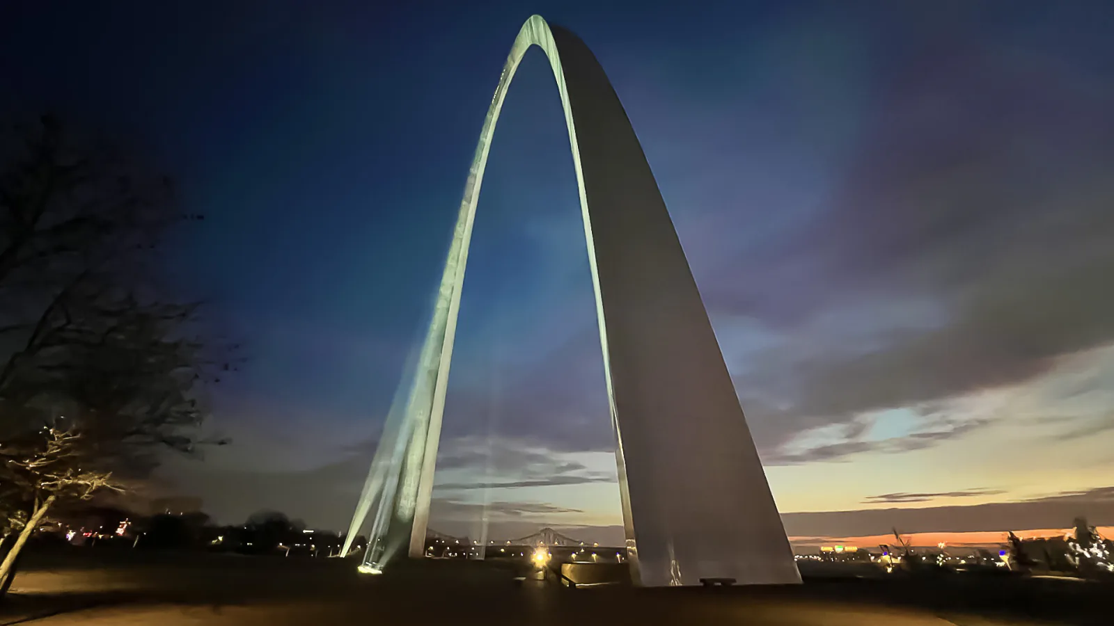 Illuminated Gateway Arch at sunrise in Gateway Arch National Park