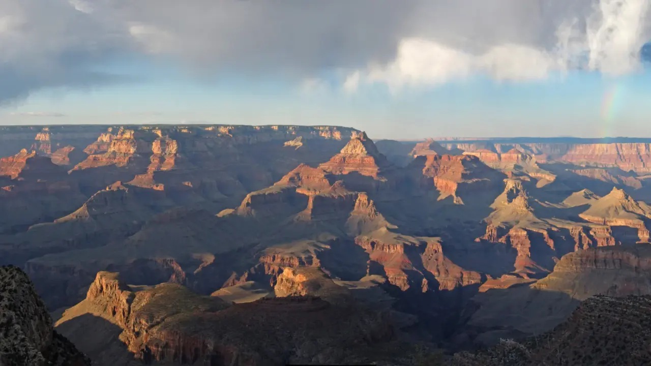 Sunset and a faint rainbow at Grandview Point in Grand Canyon National Park