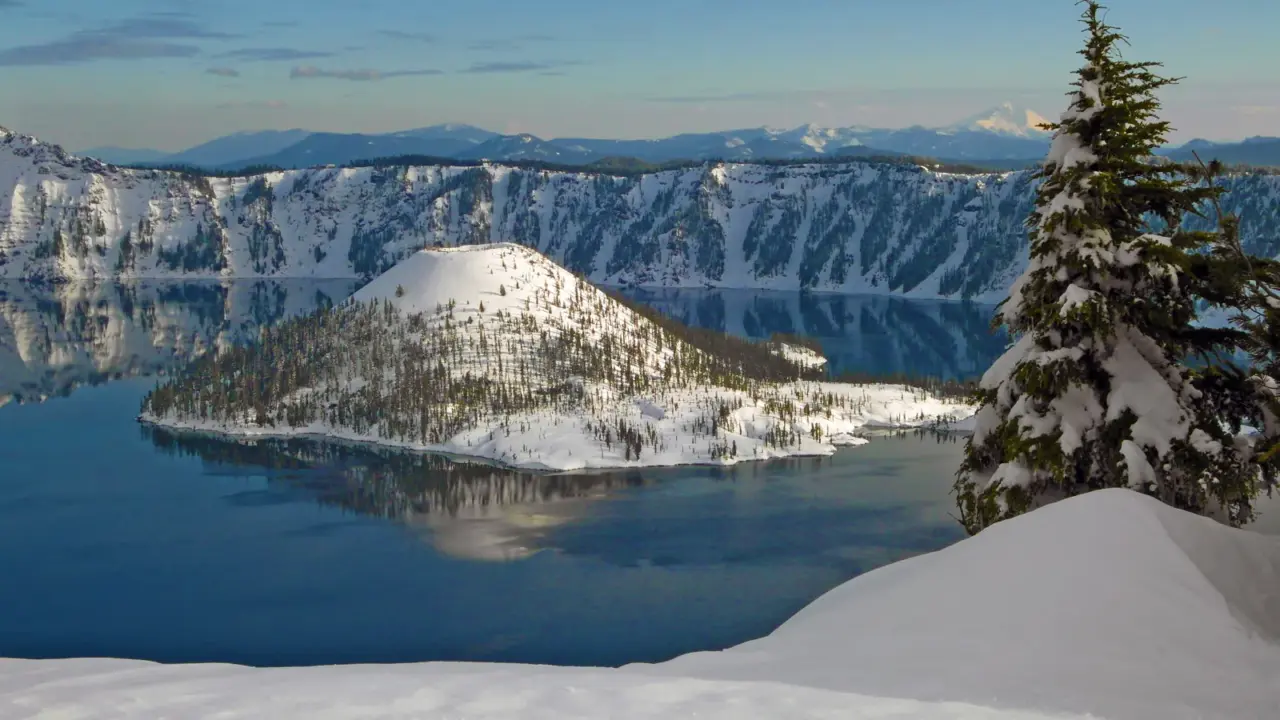 Snow-covered Wizard Island in Crater Lake National Park