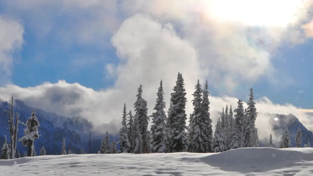 Clouds above the snow-covered Tatoosh Range in Mount Rainier National Park